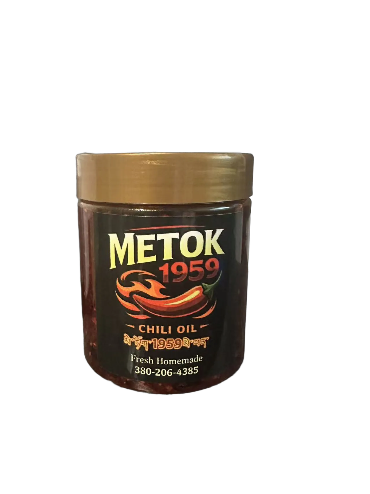 A jar of Metok 1959 chili oil with a gold lid